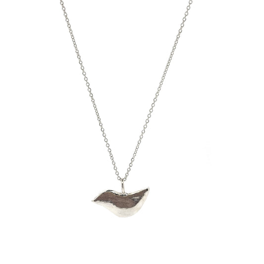 A silver stylised bird pendant on a silver chain.