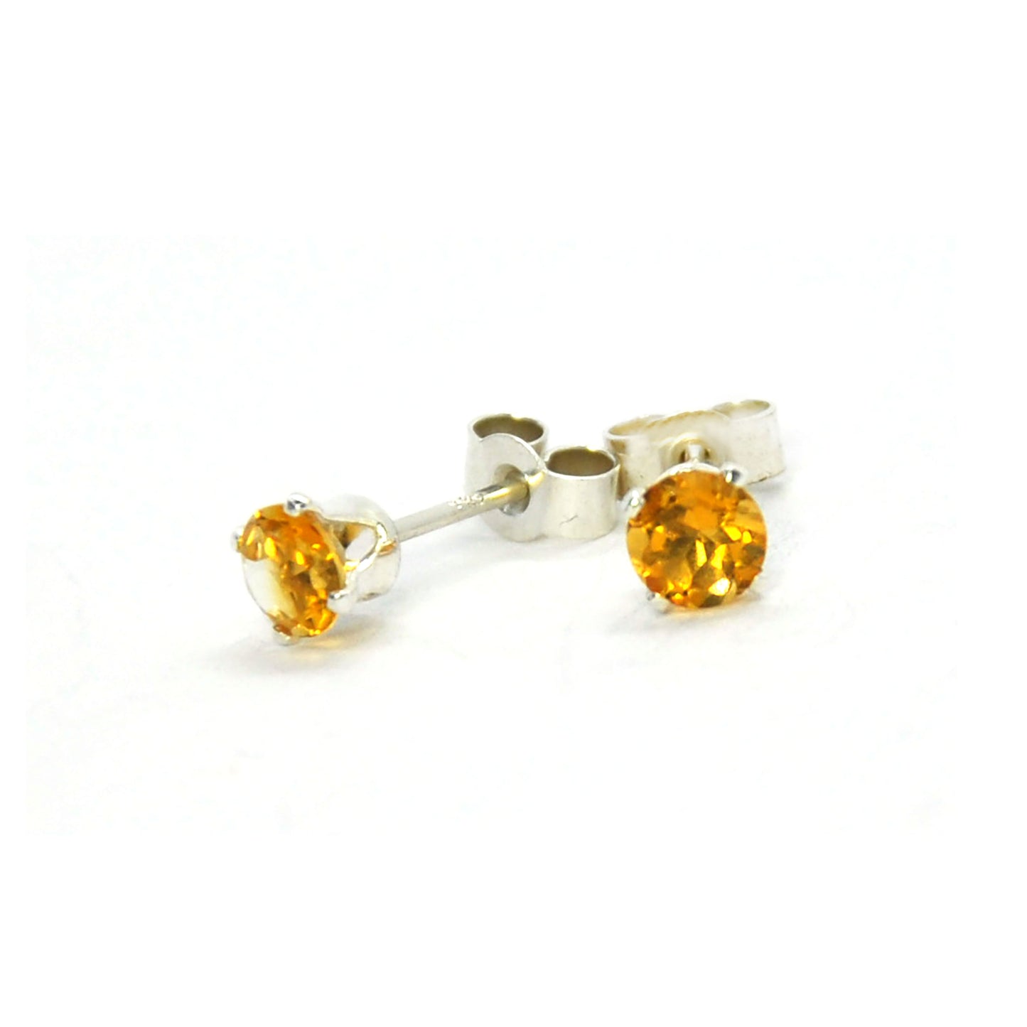 Silver 4 claw stud earrings with golden yellow citrine gemstones.