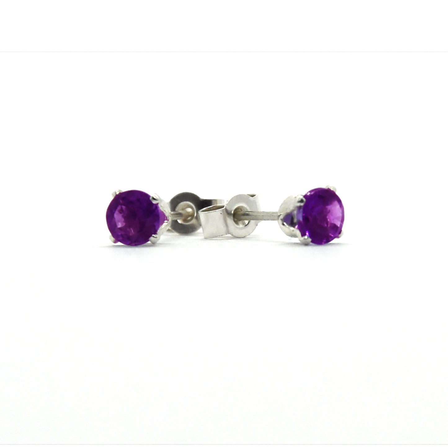 Silver 4 claw stud earrings set with purple amethyst gemstones.