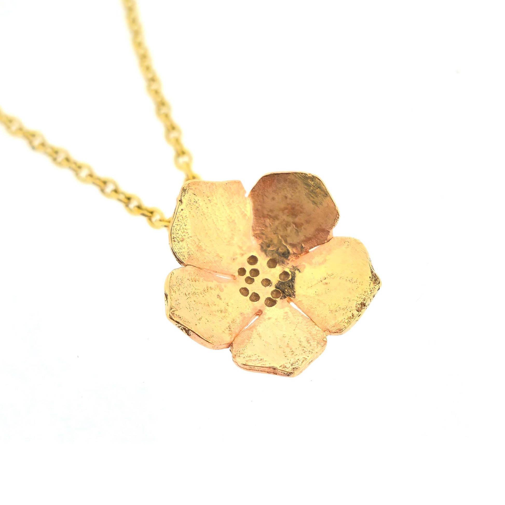 9ct yellow gold necklace chain with a flower pendant on a white background.