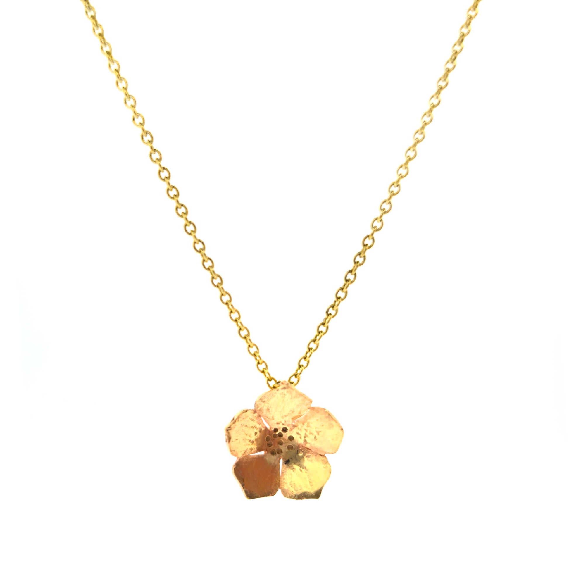 9ct yellow gold necklace chain with a flower pendant on a white background.