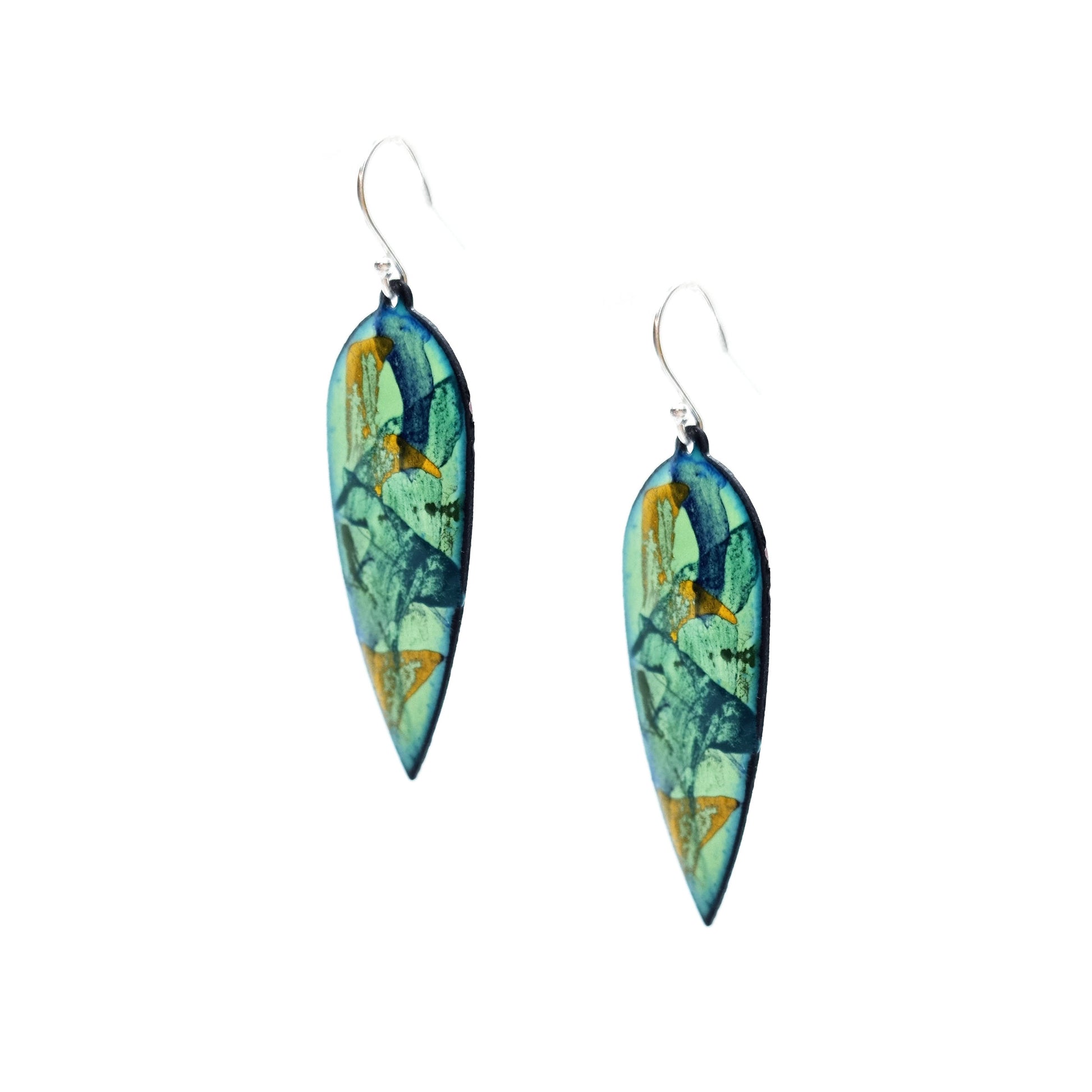 Large teardrop-shaped enamel drop earrings with splashes of dark blue, green and yellow on a light green background