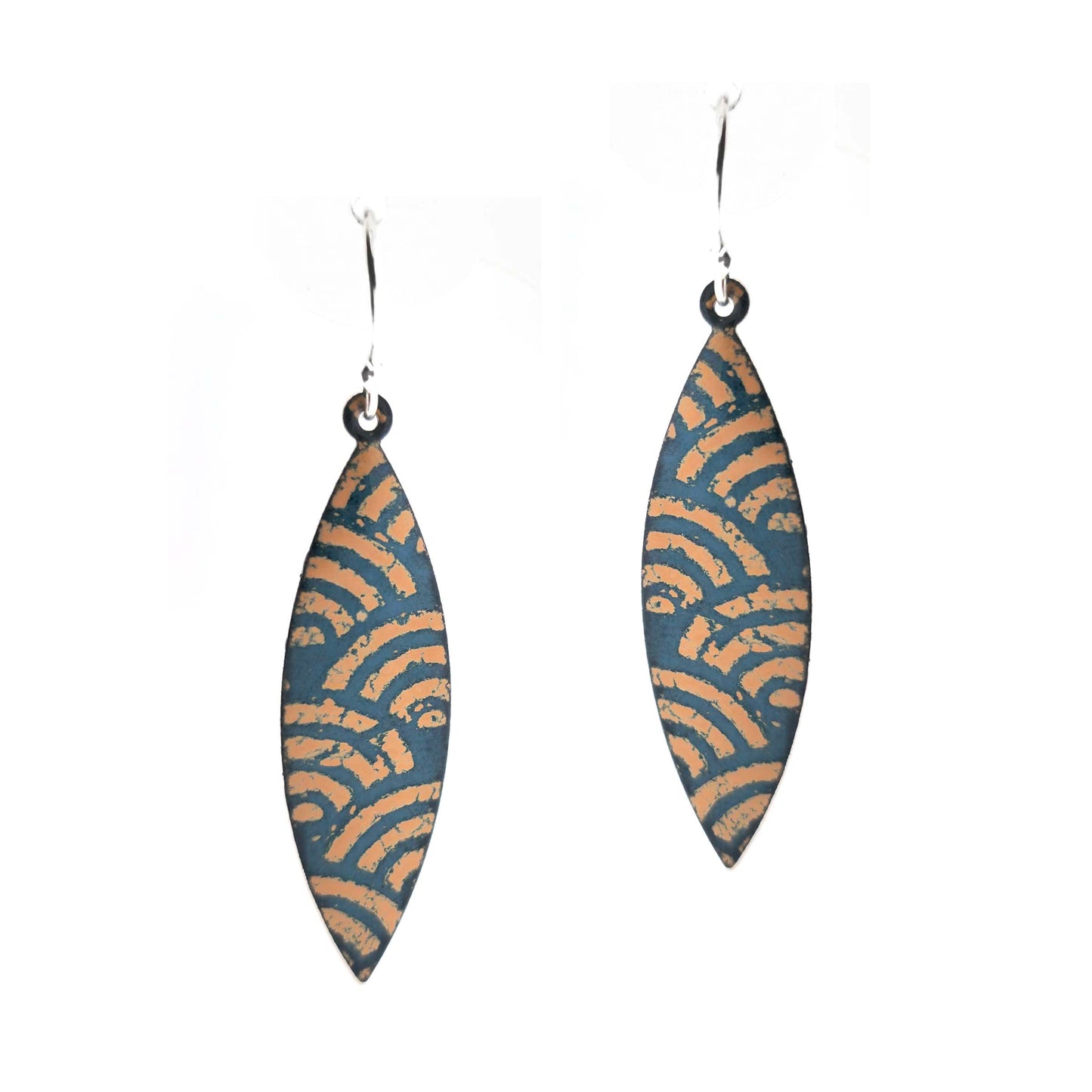 A pair of boat shaped drop earrings with a dark green background and an art deco style fan pattern in gold enamel. On silver ear hooks.
