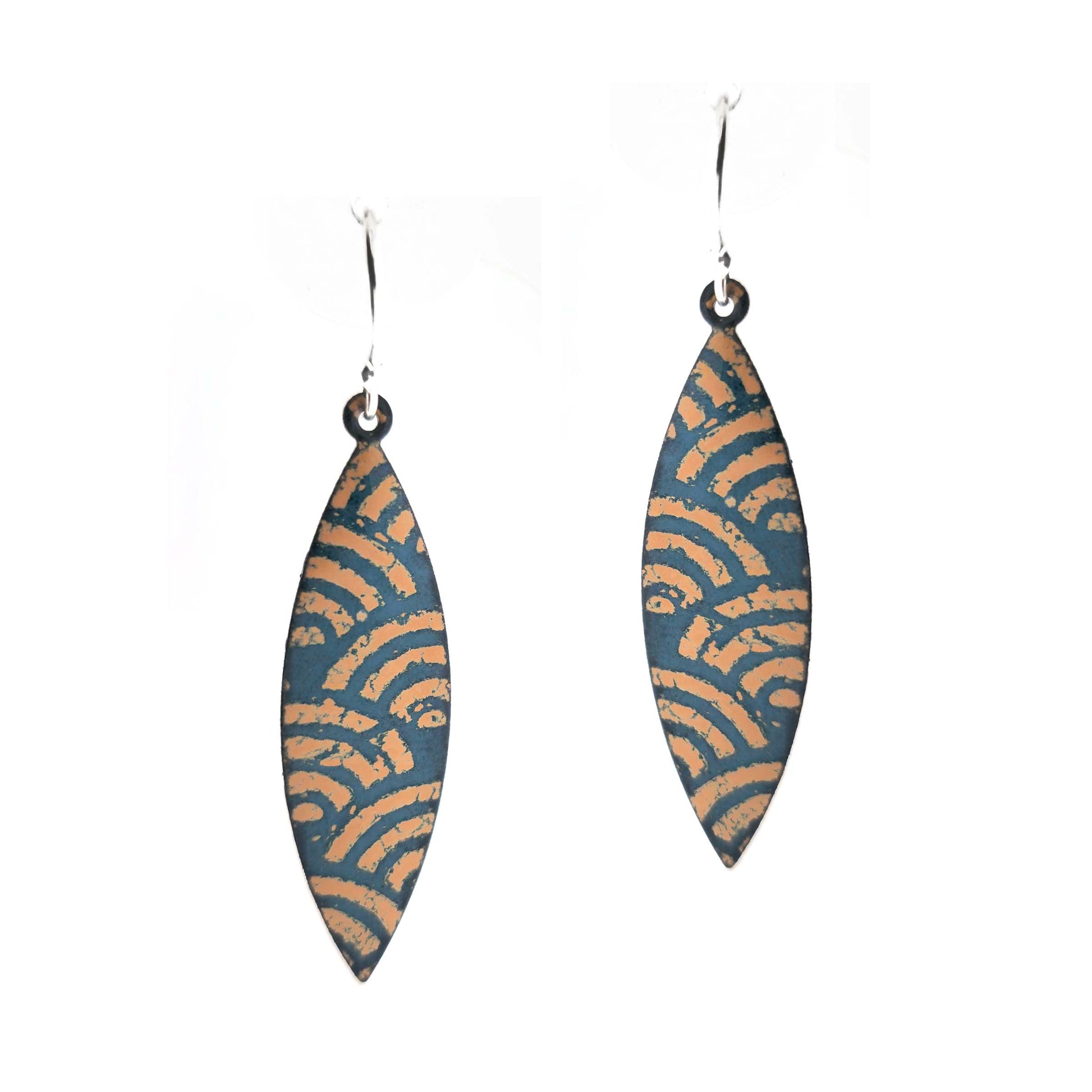 A pair of boat shaped drop earrings with a dark green background and an art deco style fan pattern in gold enamel. On silver ear hooks.