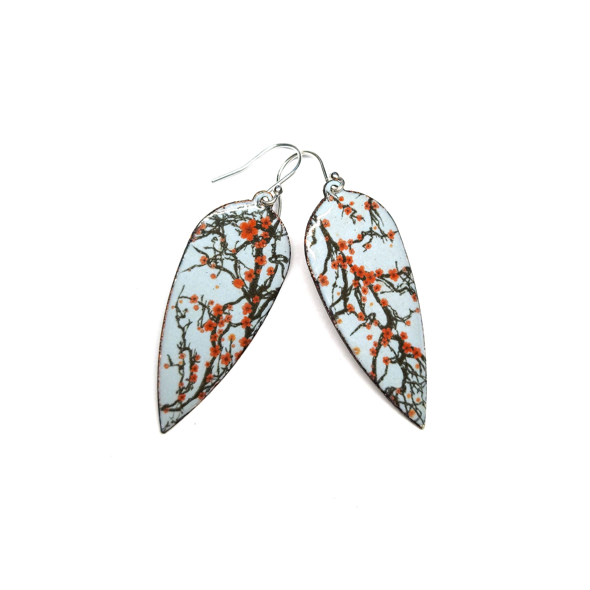 Statement enamel earrings featuring branches and red cherry blossom. On silver ear hooks. 