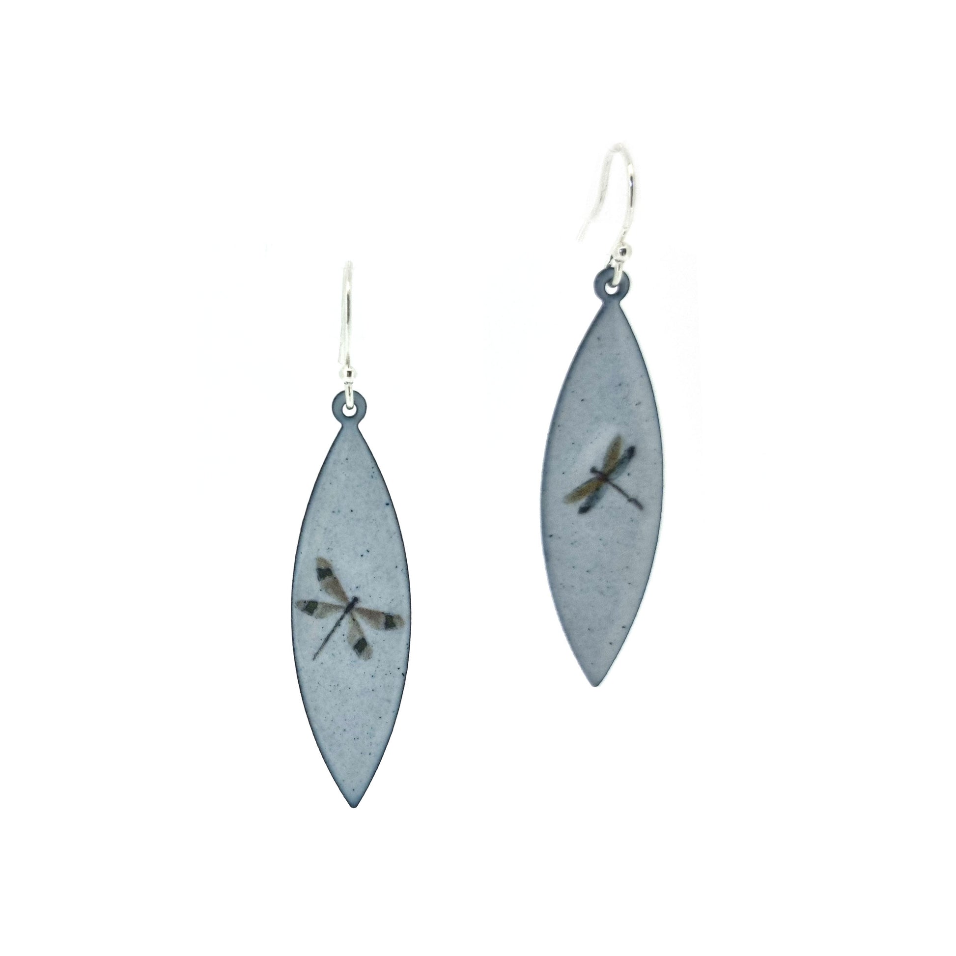 Boat shaped drop earrings with grey enamel. Each earring features one dragonfly in various colours. On silver ear hooks.