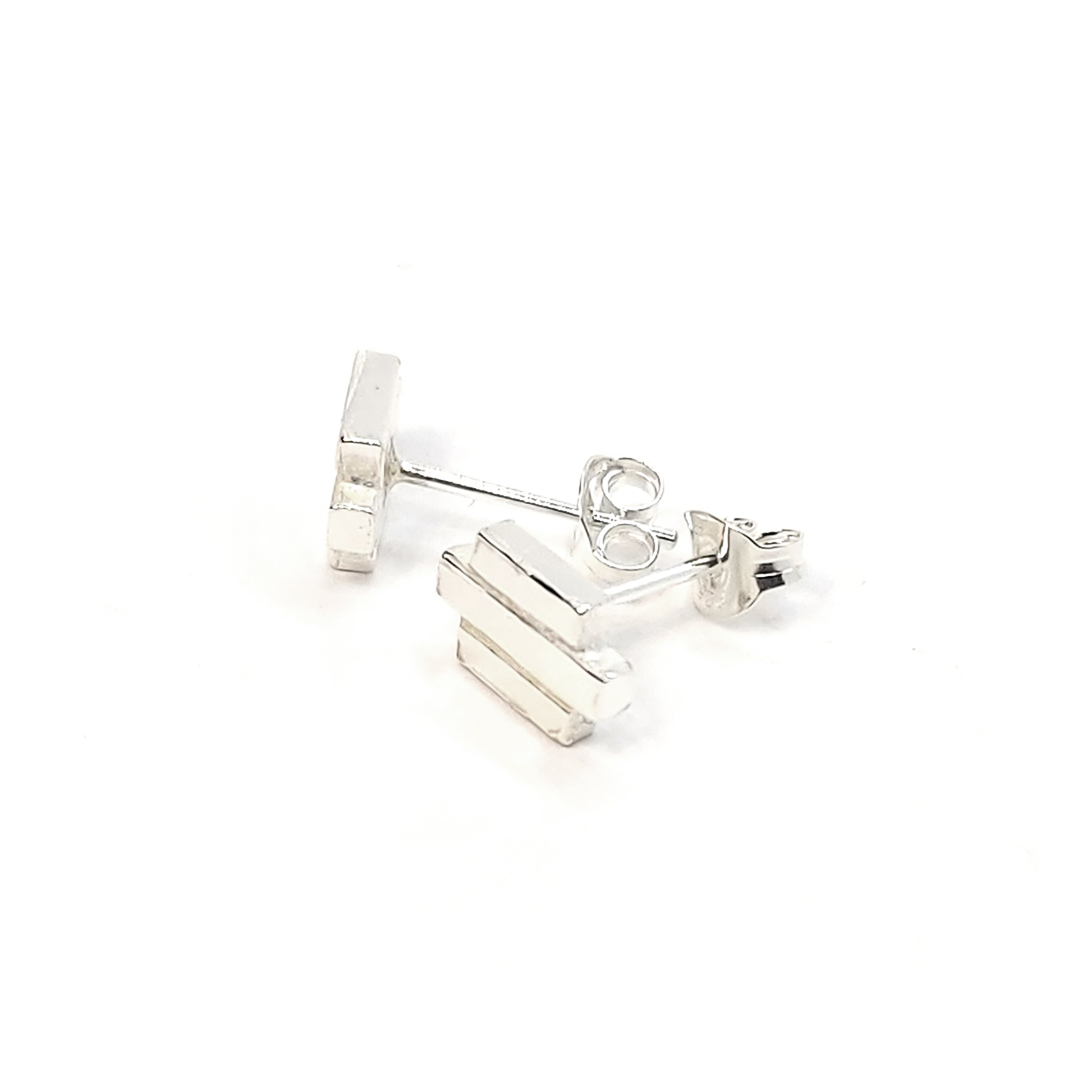 Silver Art Deco style stud earrings featuring 3 lines of silver.