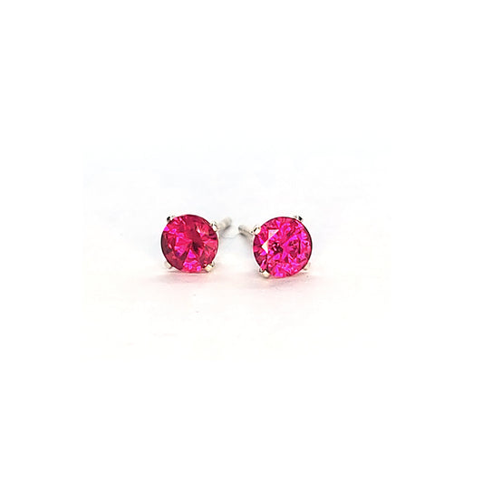 Silver 4 claw stud earrings with a round pinky red ruby gemstone in each. 4mm.