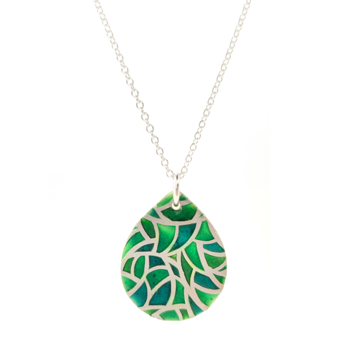 A handmade teardrop-shaped pendant necklace featuring a green enamel mosaic pattern with a silver chain, shown against a plain white background. Mijoux Jewellery.