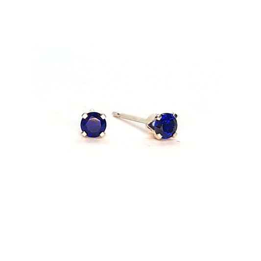 Silver 4 claw stud earrings set with dark blue sapphires. 3mm