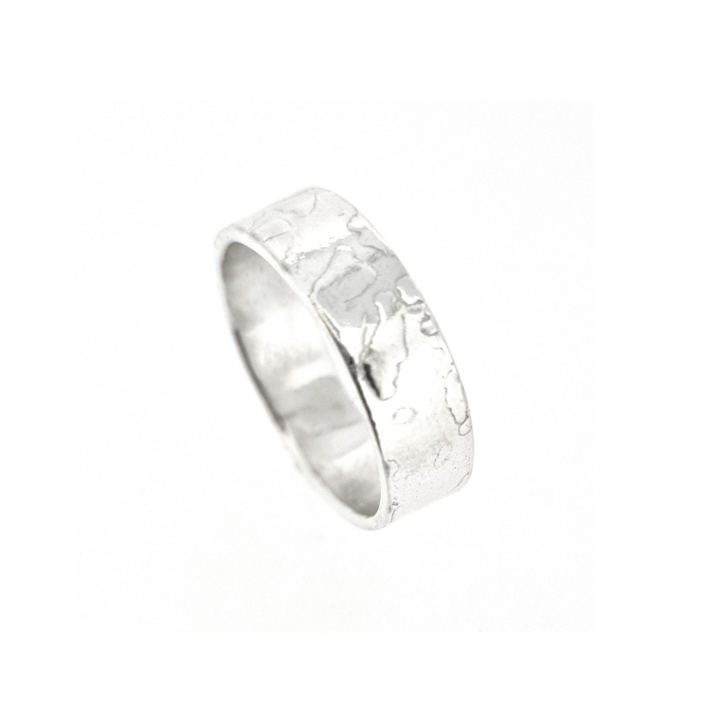 Silver band ring with islands in the sea style pattern.