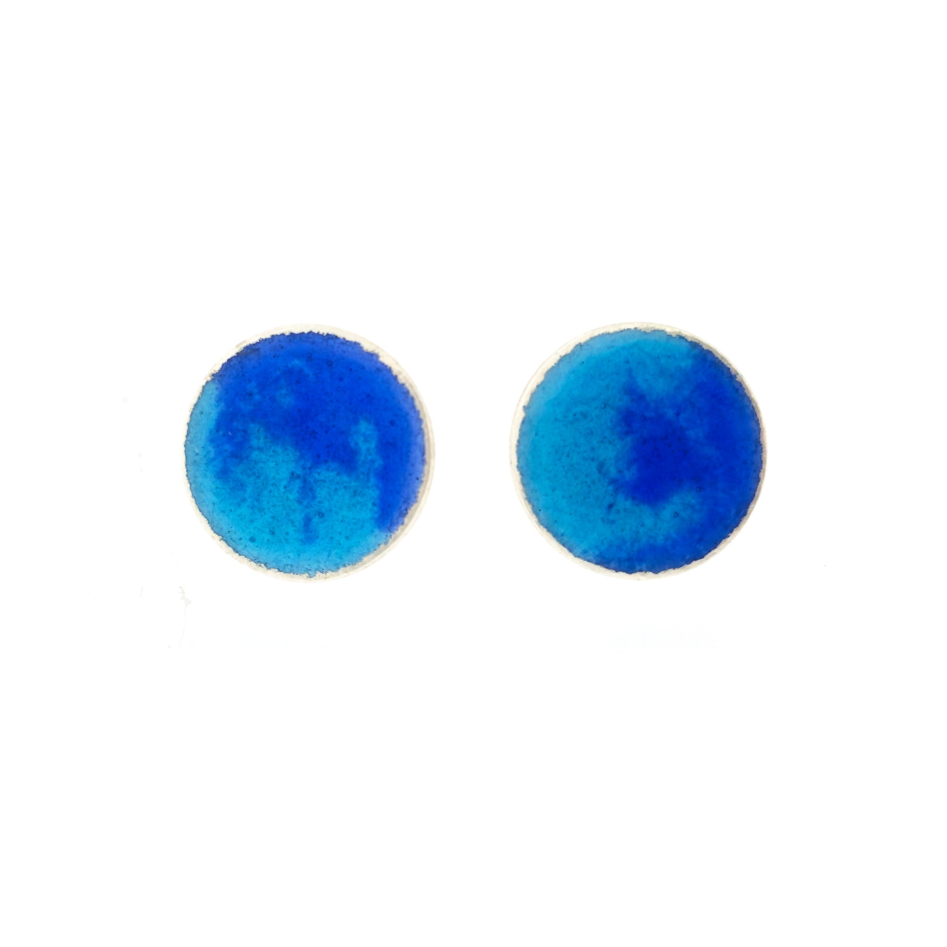 Round silver stud earrings with a mix of blue enamels.