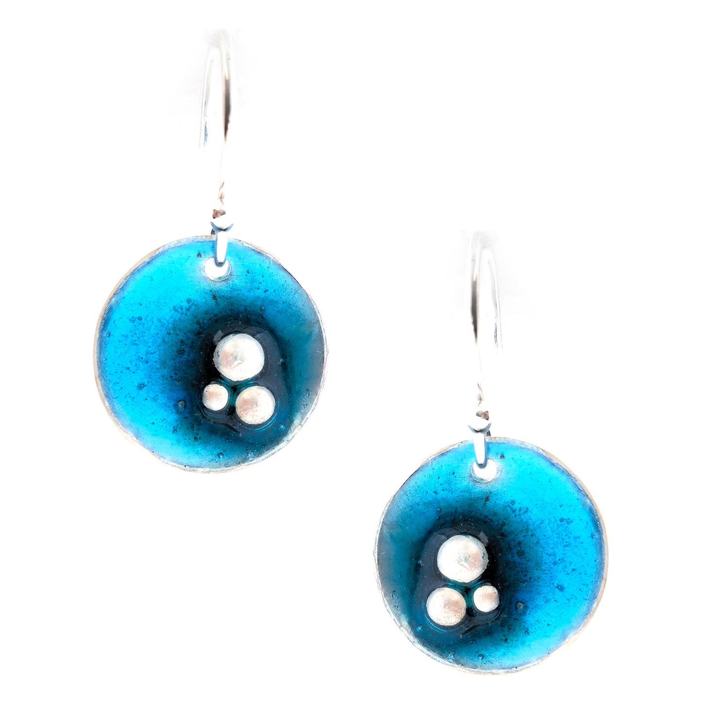 Handmade round silver drop earrings. Each earring has 3 silver balls off-centre and a turquoise blue enamel. Suspended from silver ear hooks. Mijoux Jewellery.
