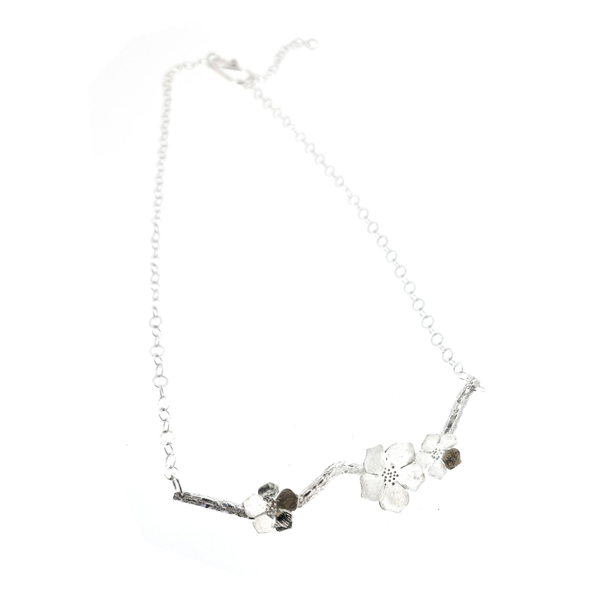 Silver branch necklace with three blossom flowers and open large link chain.