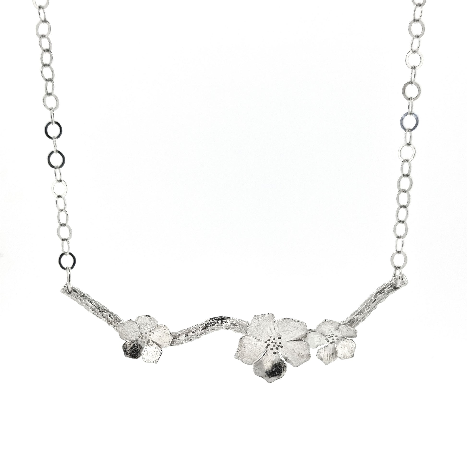 Silver branch necklace with three blossom flowers and open large link chain.