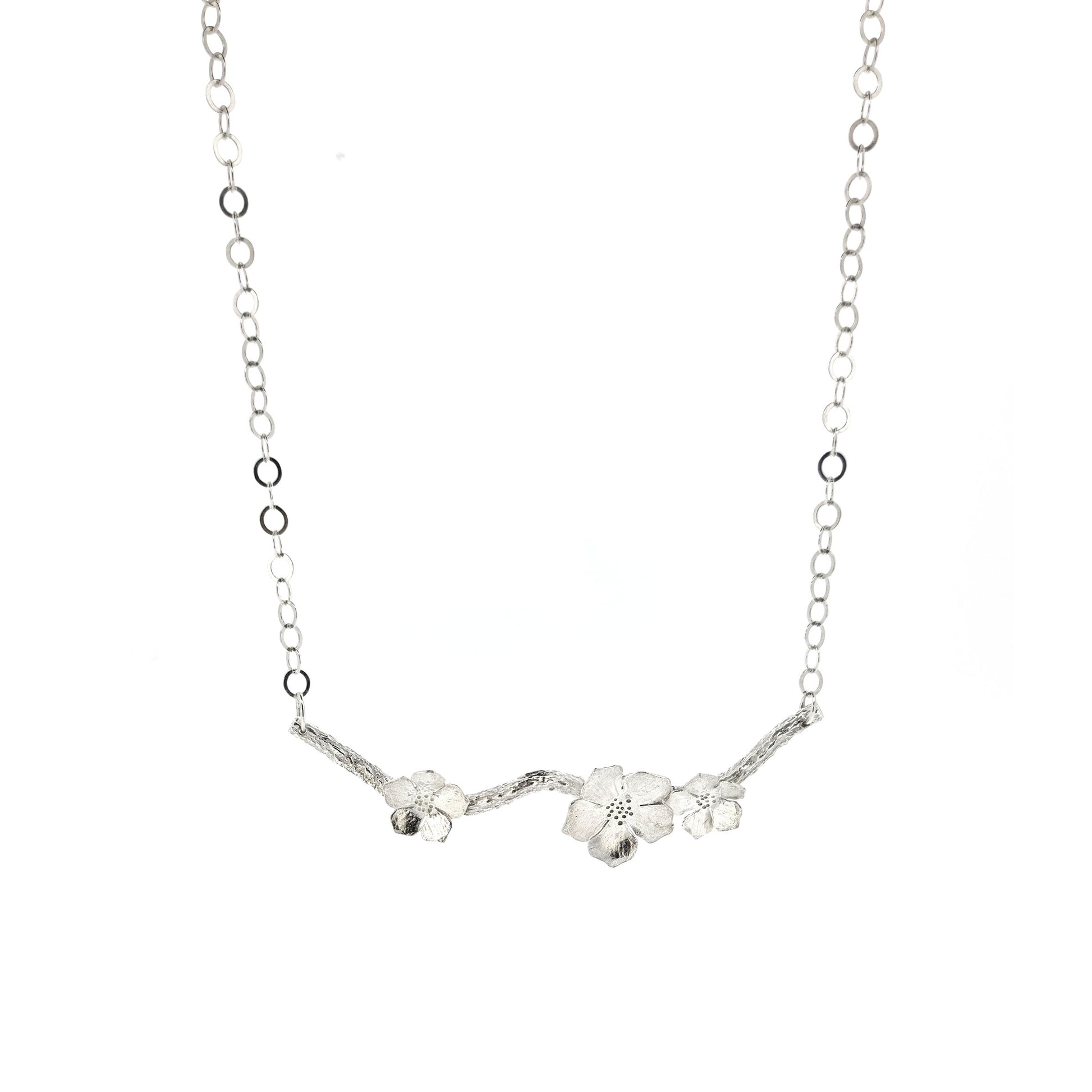Silver branch necklace with three blossom flowers and open large link chain.