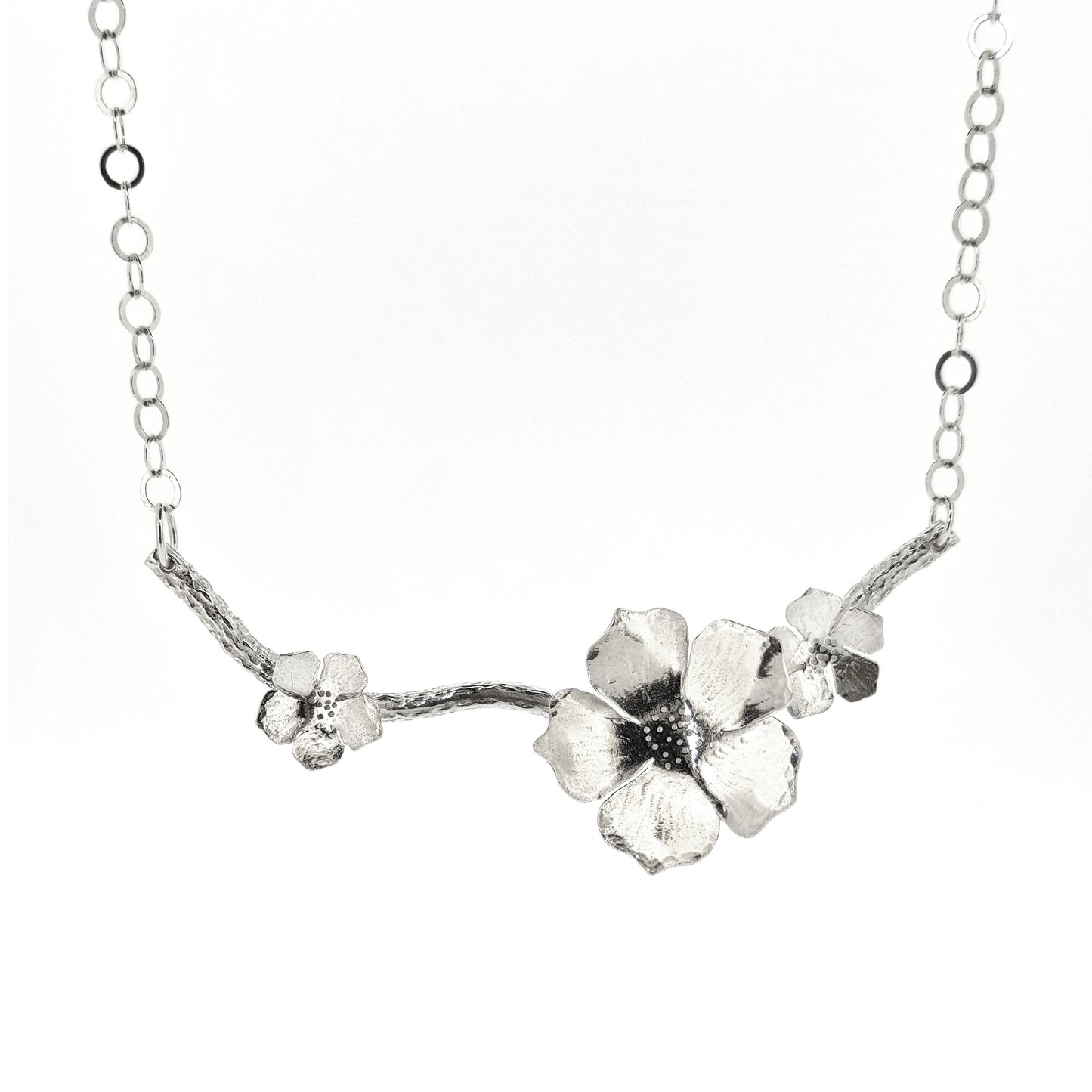 Silver branch necklace with three blossom flowers and open large link chain.