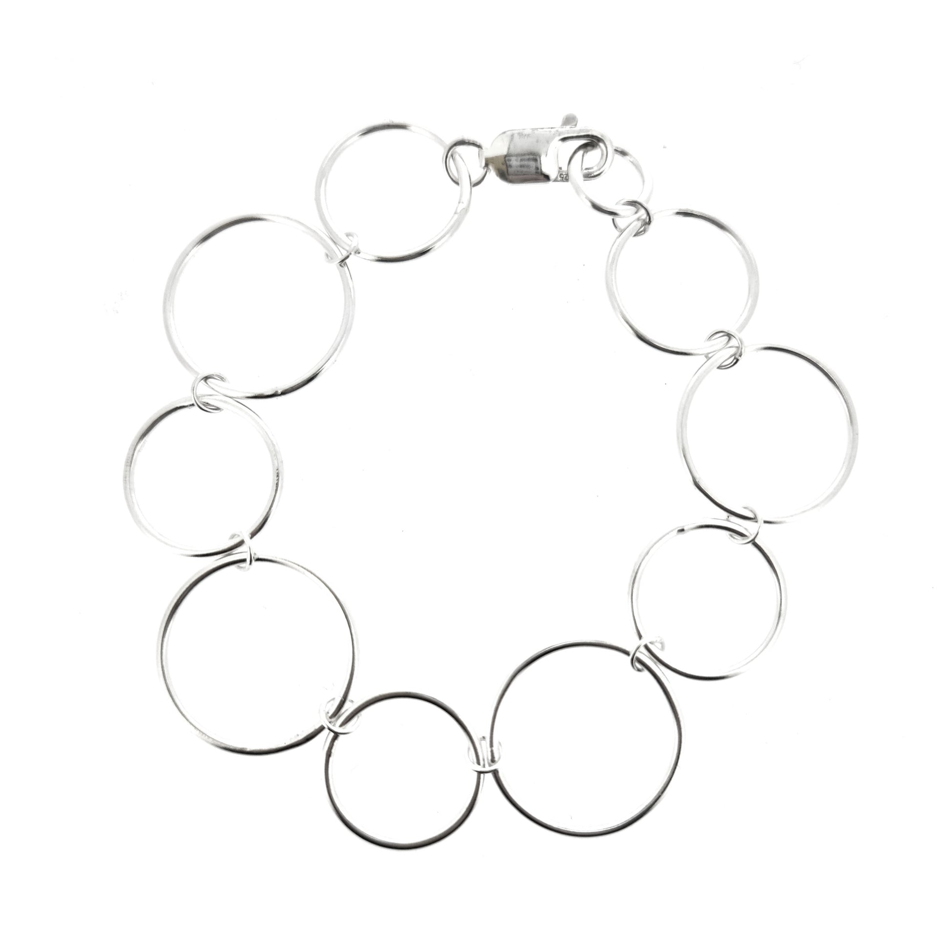 Silver chain link bracelet with circle links of different sizes.