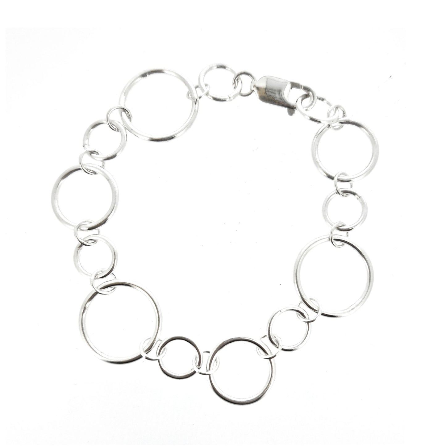 Silver chain link bracelet with circle links of different sizes.