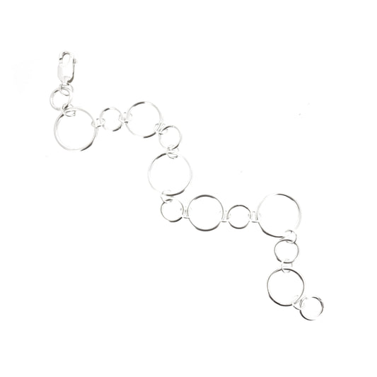 Silver chain link bracelet with circle links of different sizes.