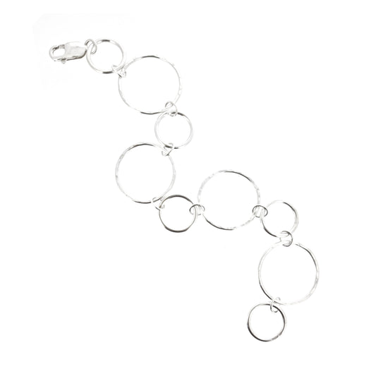 Silver chain link bracelet with 2 sizes of circles, one size has a hammered finish