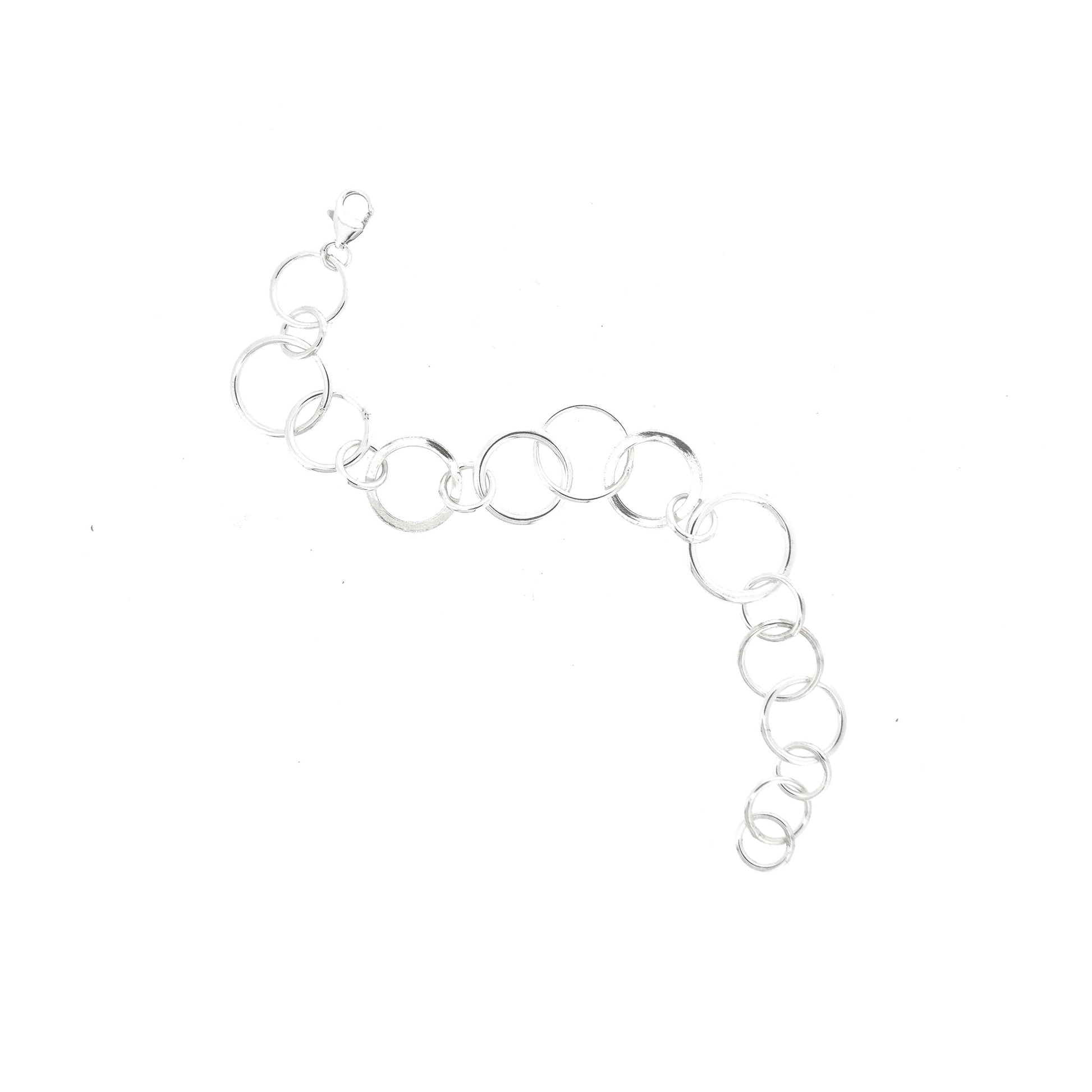 A silver linked bracelet made up of circles of different shapes and sizes.