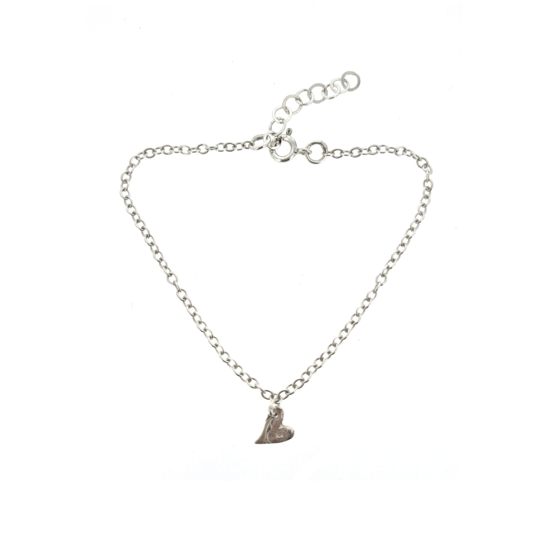 Sterling silver adjustable chain bracelet with small asymmetrical heart charm.