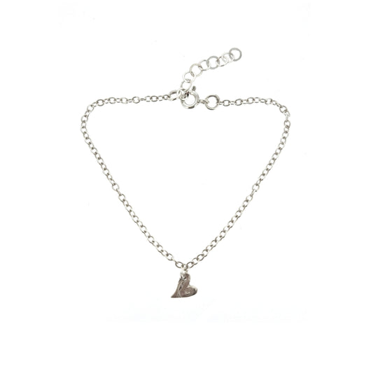 Sterling silver adjustable chain bracelet with small asymmetrical heart charm.