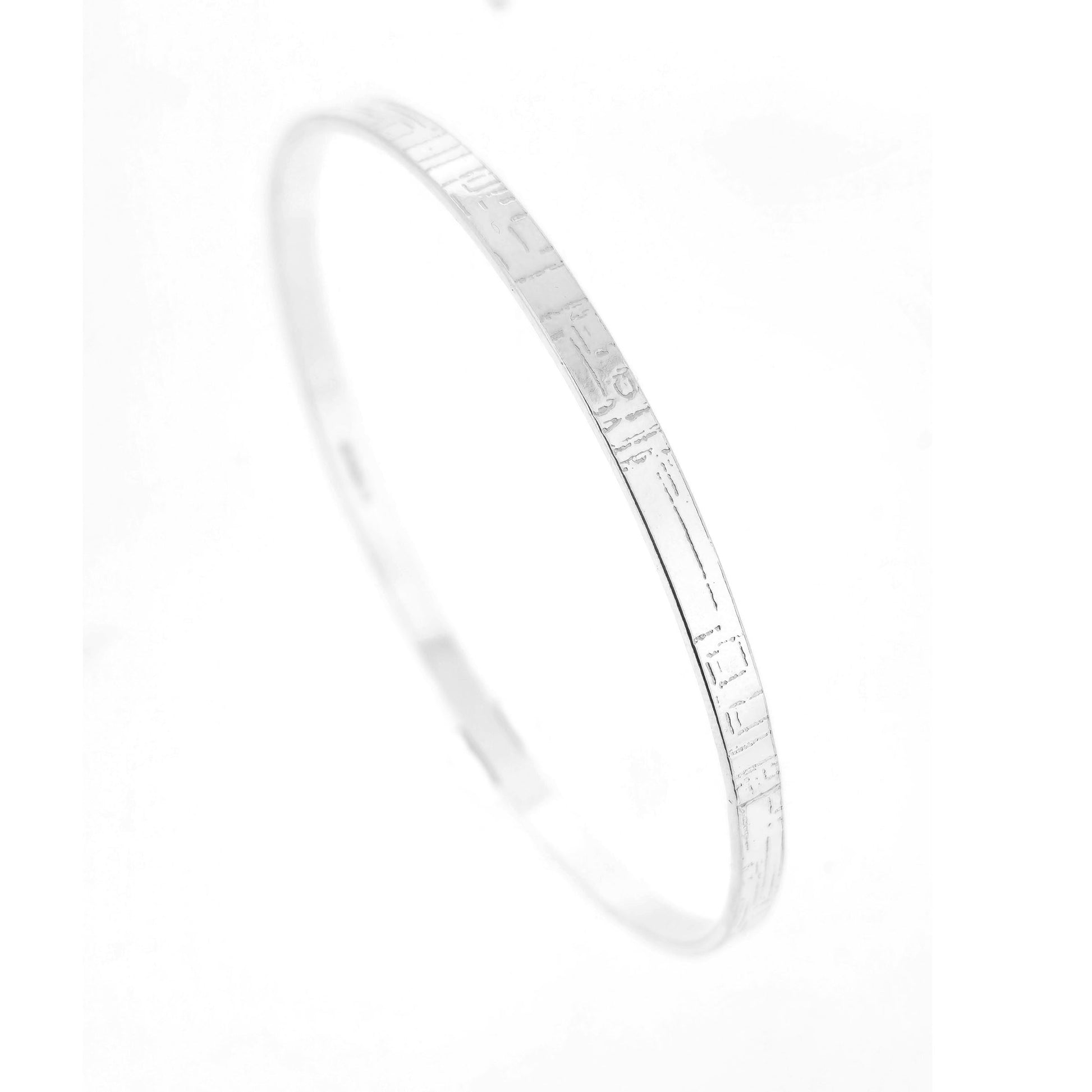 A flat sterling silver bangle with a square and line pattern. Mijoux Jewellery.