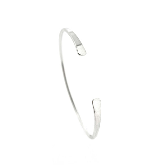 A silver open torque bangle with flattened ends.