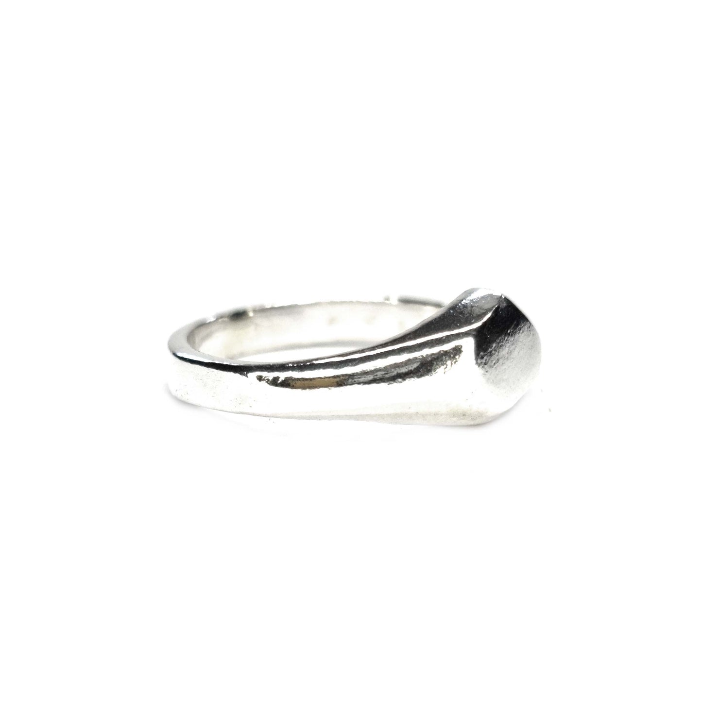 A silver geometric signet ring with flat head.