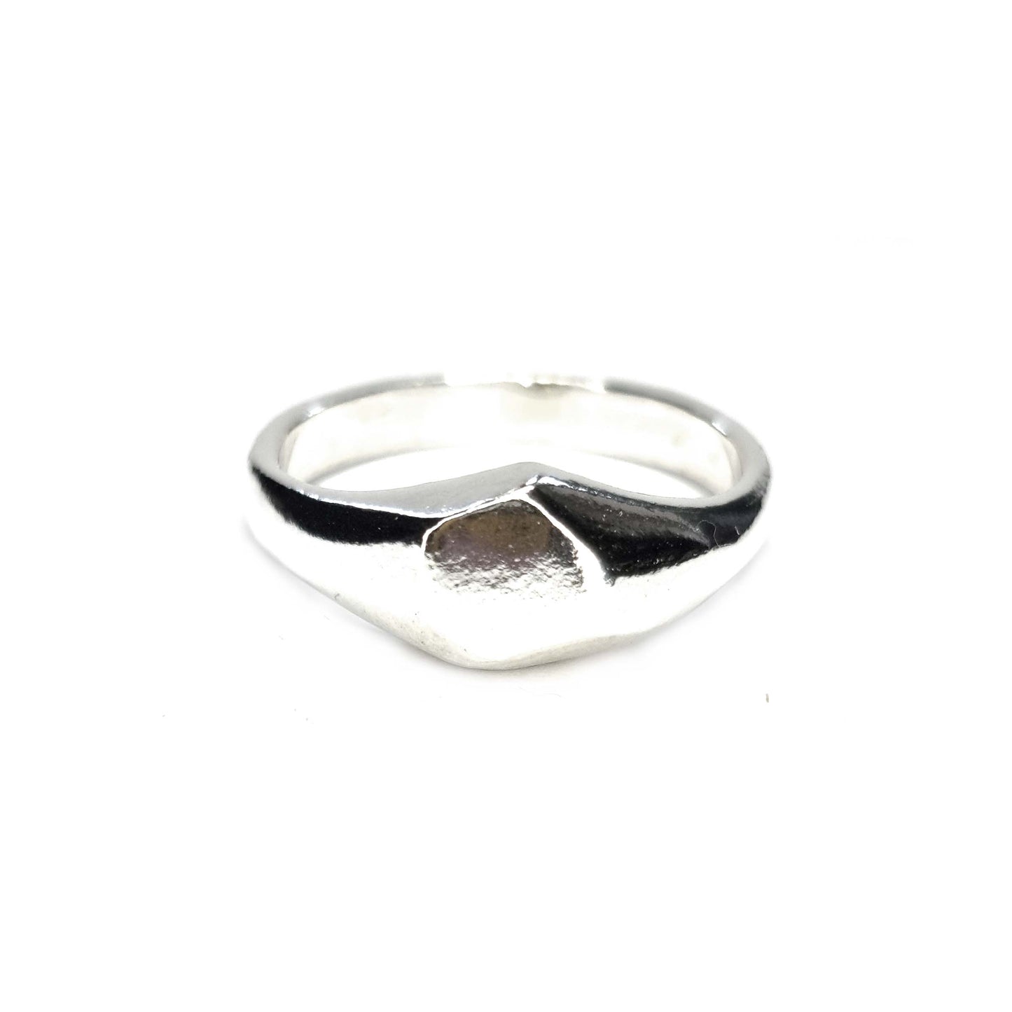 A silver geometric signet ring with flat head.