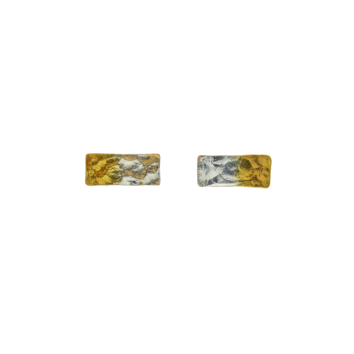 Silver rectangular stud earrings with a hammered finish and one half gold plated.