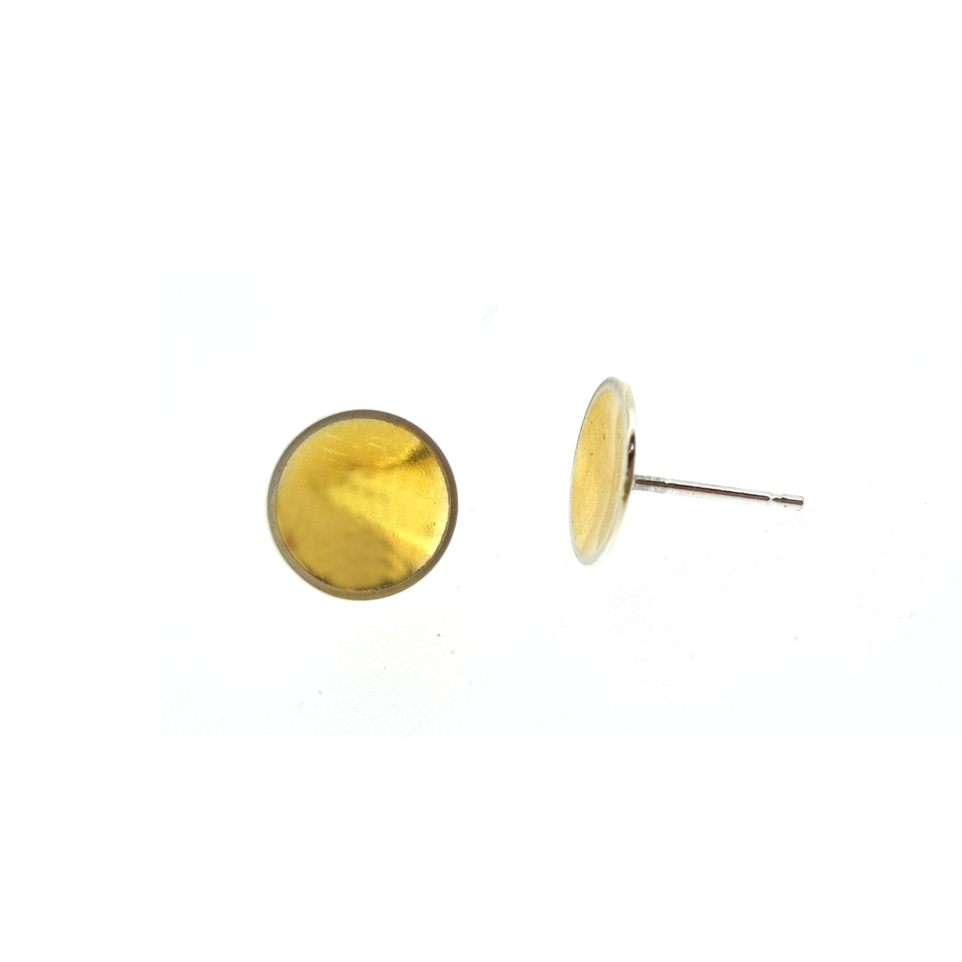 Silver round stud earrings with a gold center. Large.