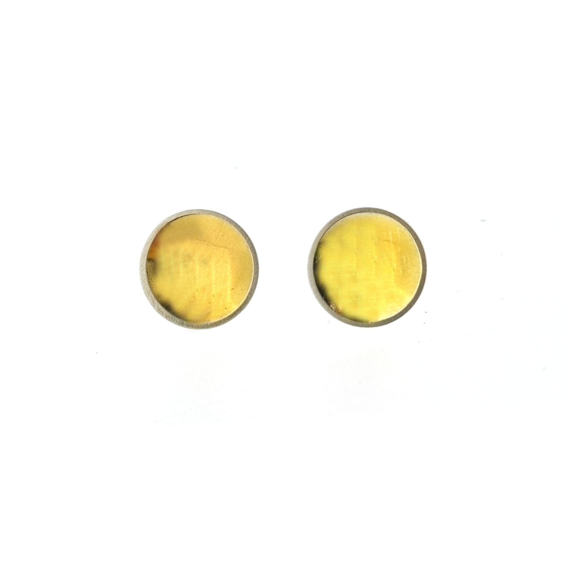 Silver round stud earrings with a gold center. Large.