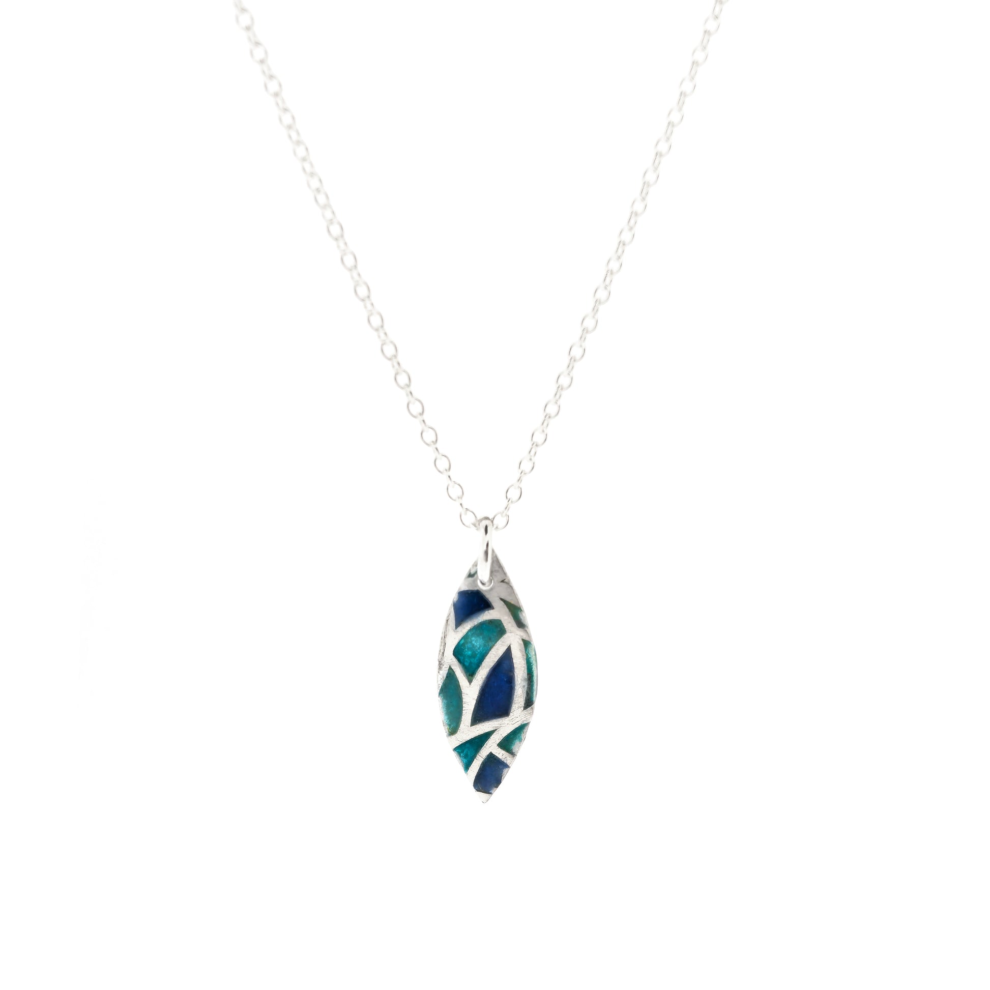 A marquise shaped silver pendant with geometric cells of blue, green and turquoise enamel. On a silver chain. Small.