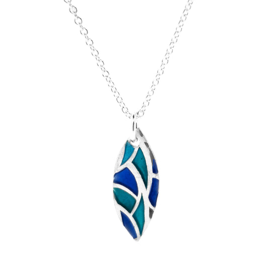 A marquise shaped silver pendant with geometric cells of blue, green and turquoise enamel. On a silver chain. Small.
