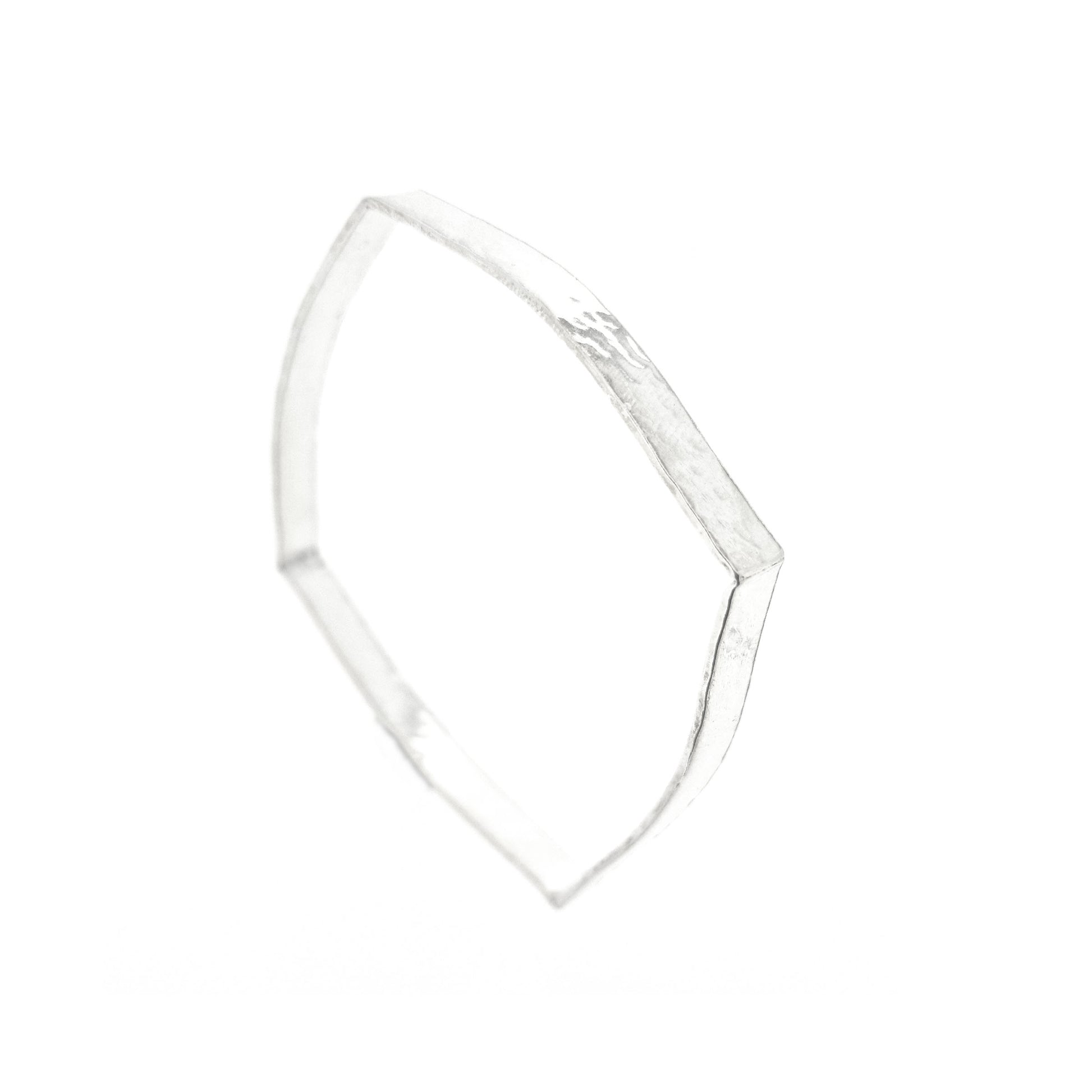 Silver hammered bangle with a round and square profile.