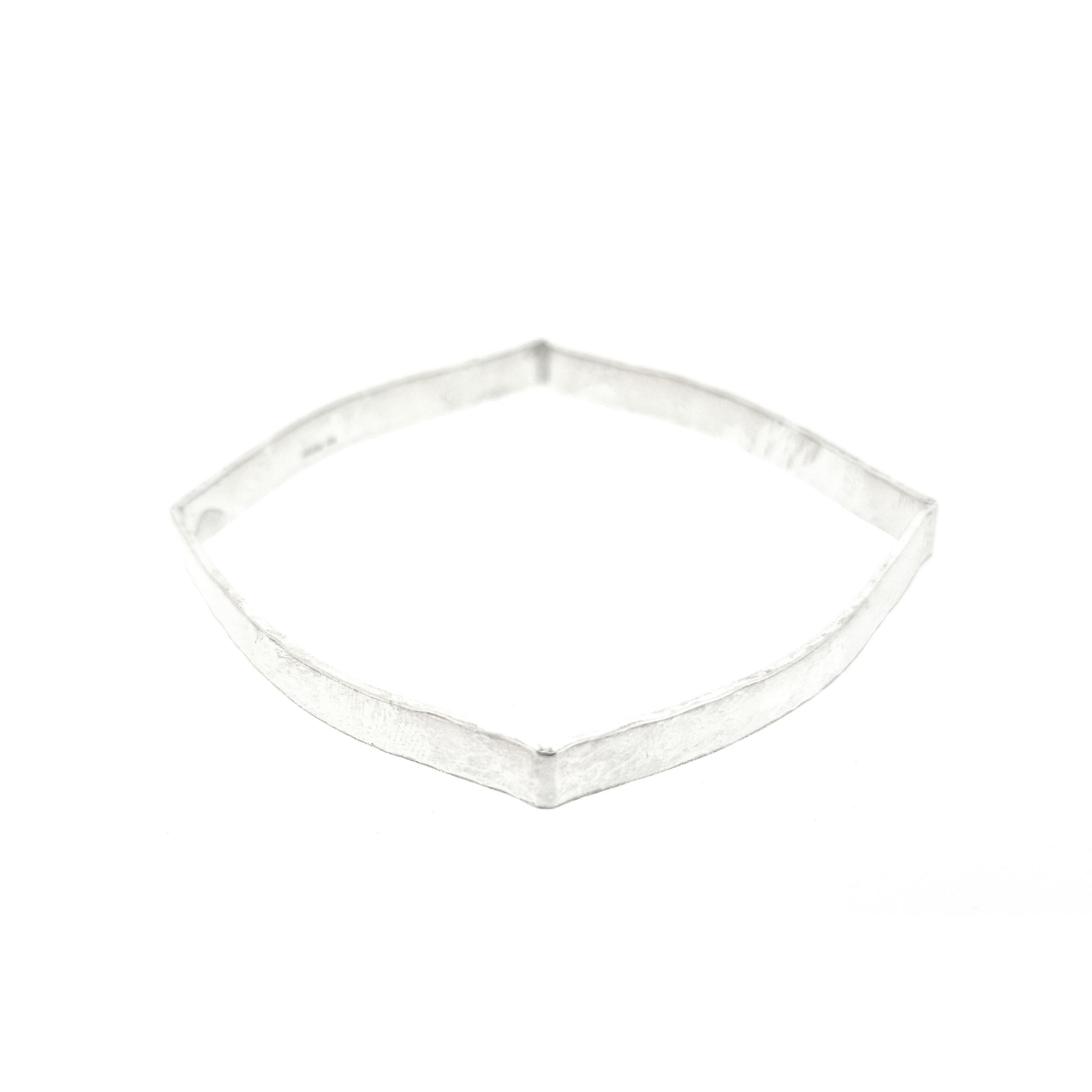 Silver hammered bangle with a round and square profile.