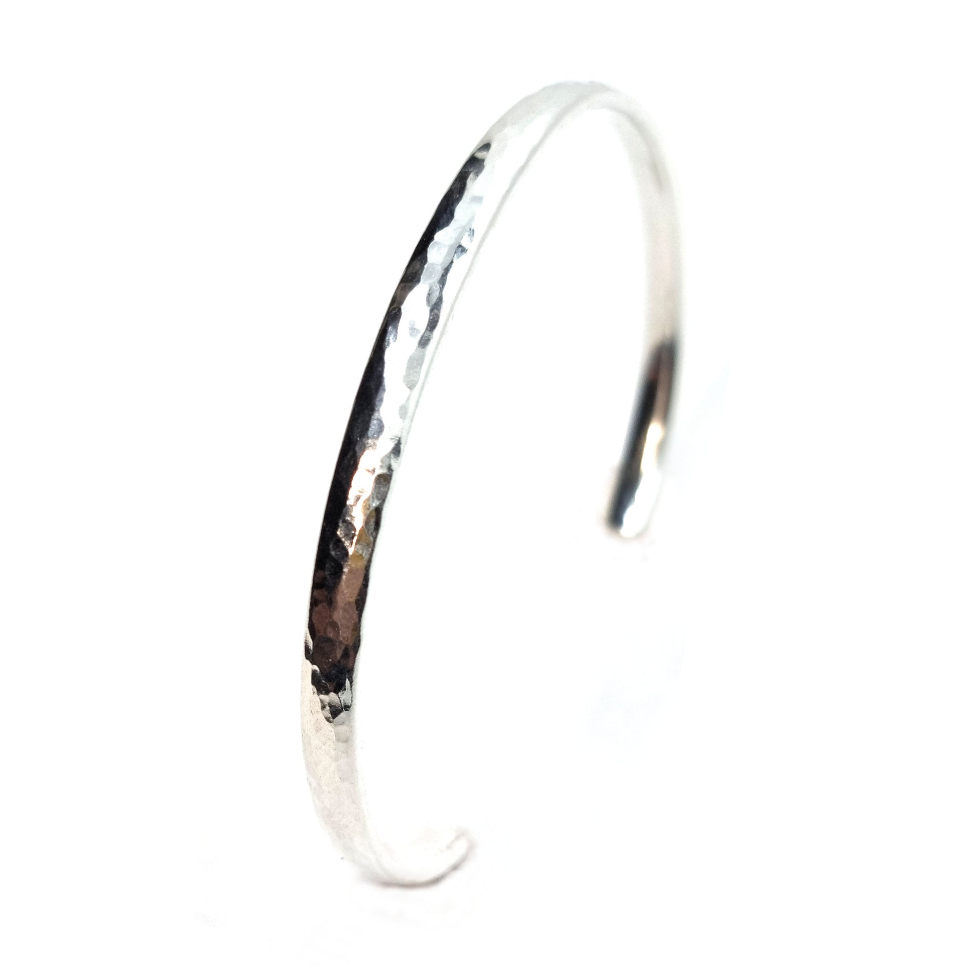 Silver hammered open torque bangle.
