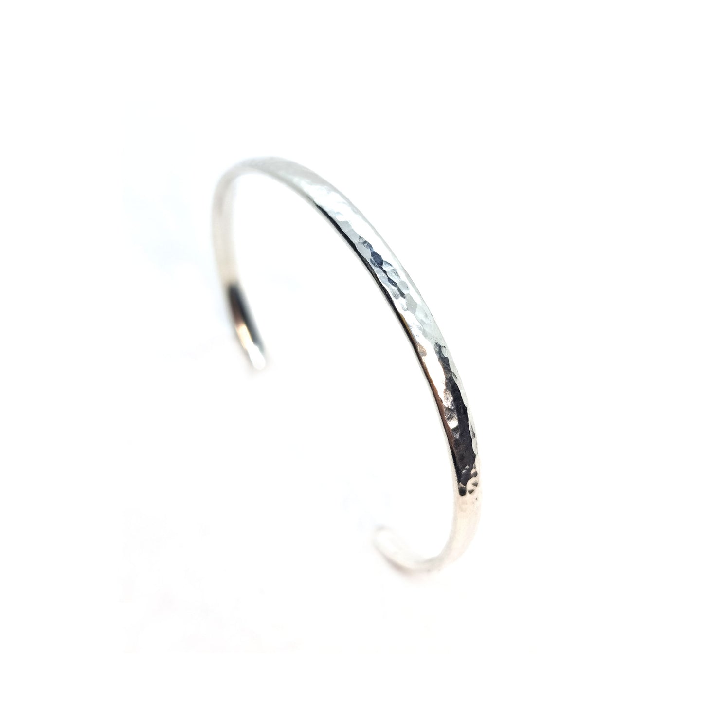 Silver hammered open torque bangle.