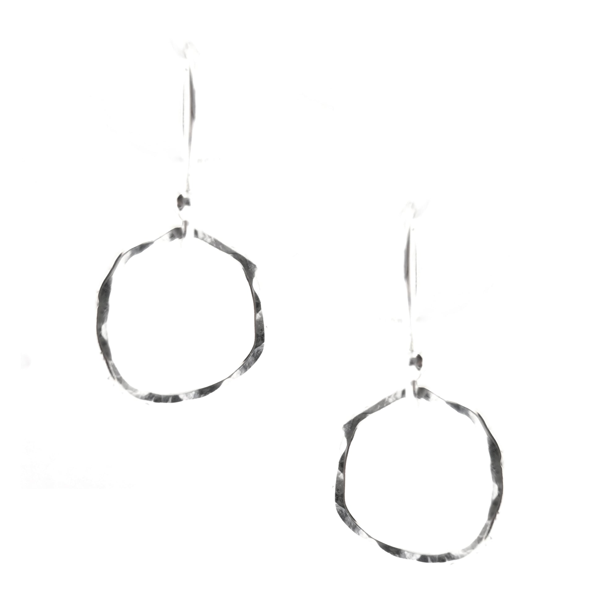 Silver drop earrings with an open organic rustic style circle suspended from silver ear wires - small.