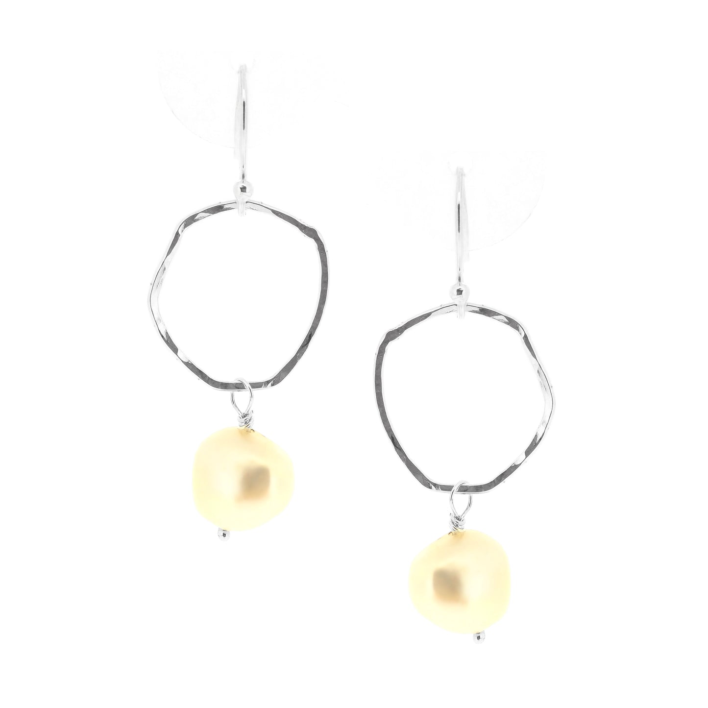 Silver drop earrings consisting of an organic rustic style open circle with a hammered finish suspended from silver ear hooks and with a white pearl hanging from it. Large.