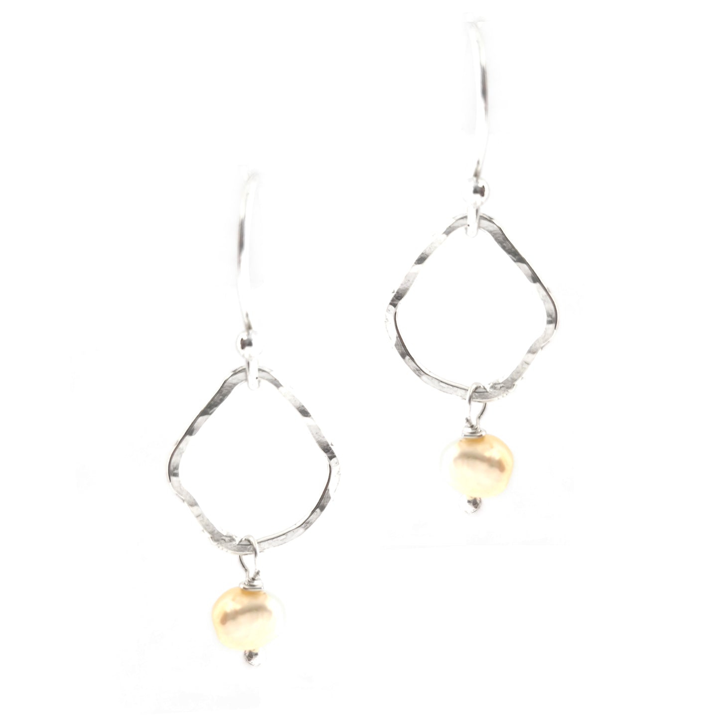 Silver drop earrings consisting of an organic rustic style open circle with a hammered finish suspended from silver ear hooks and with a white pearl hanging from it. Small.