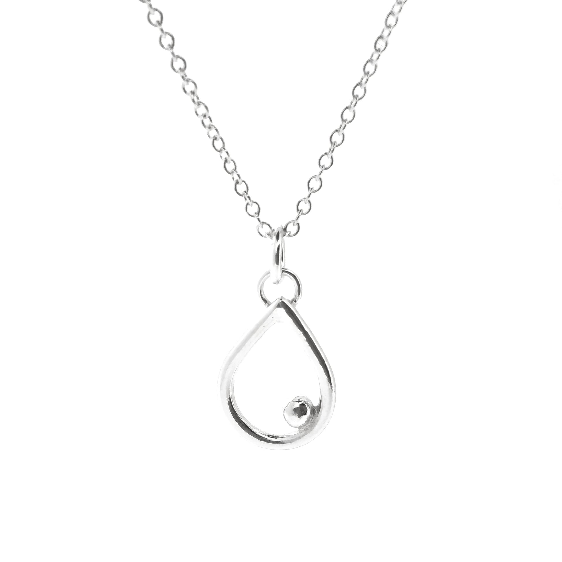 A silver open teardrop shaped pendant with an off-centre ball. On a silver chain. Small.