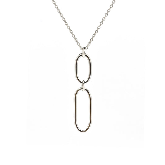 A silver pendant featuring 2 open oblong shapes on a silver chain.