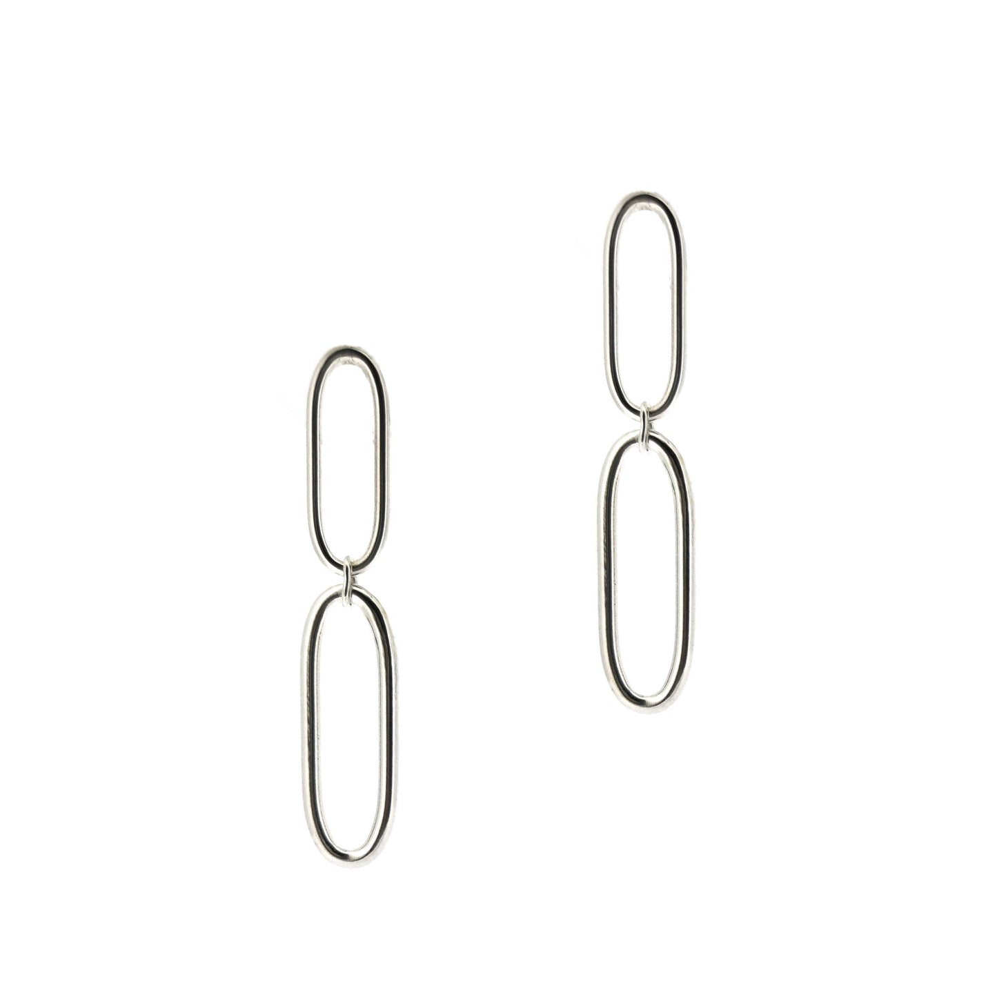 Silver drop earrings featuring 2 open oblong oval shapes attached to each other in a long drop.