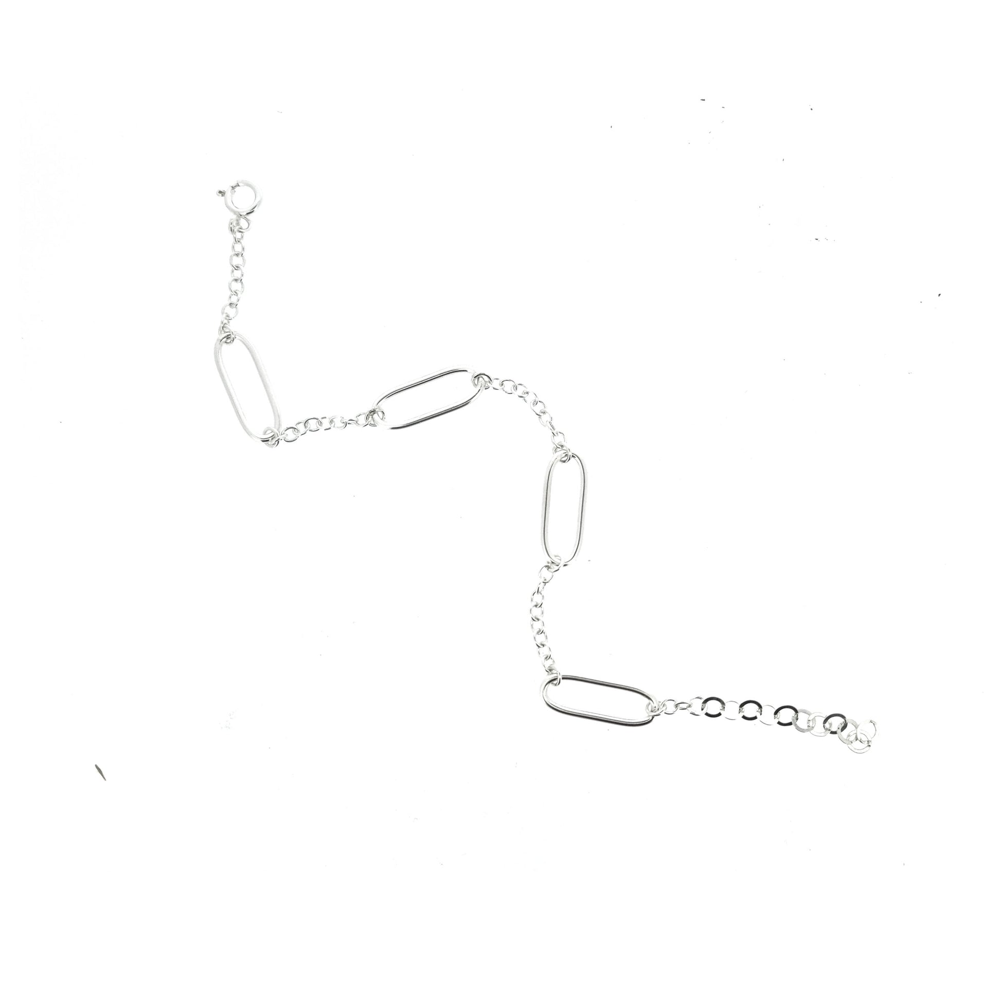 A silver bracelet with 4 oblong oval links set between round linked chain.