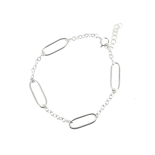 A silver bracelet with 4 oblong oval links set between round linked chain.