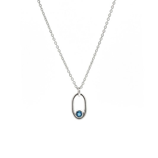 Silver open oblong pendant with a blue topaz gemstone set in the curve on a silver chain.